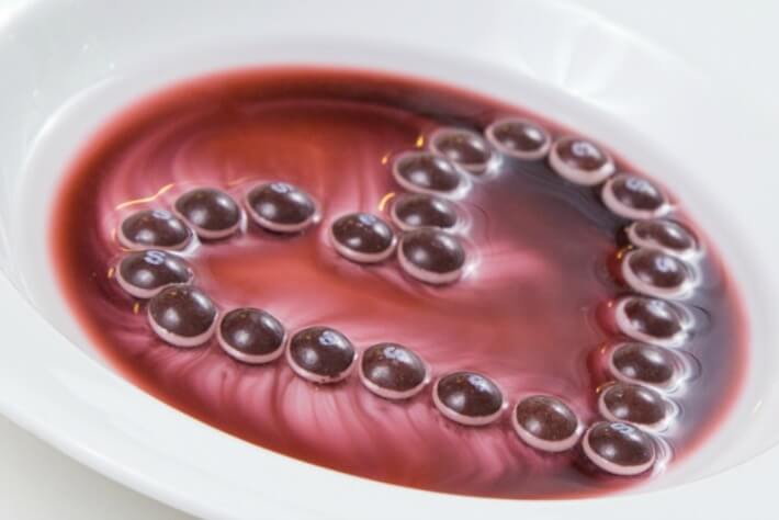 Dissolving Candy Art Heart with Purple Skittles