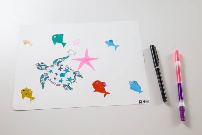 Using kids stickers as art prompts to create an under the sea scene