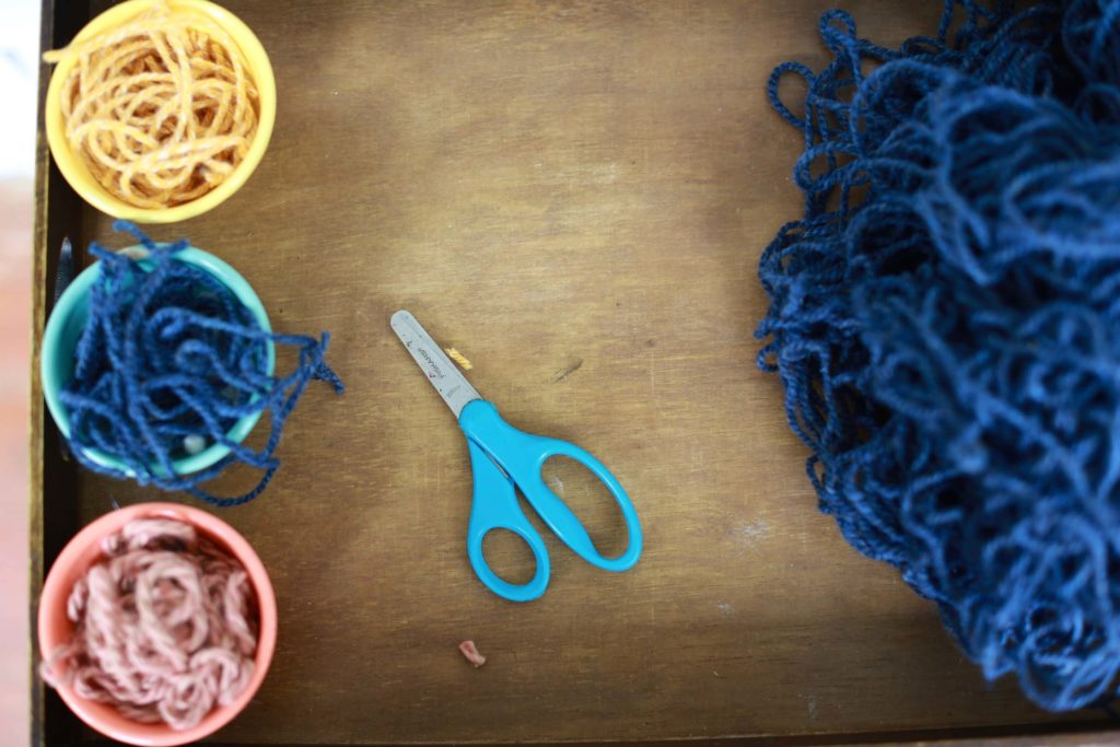 Yarn and scissors–materials for yarn suncatchers for kids
