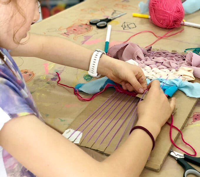 Weaving for kids with yarn and ribbon