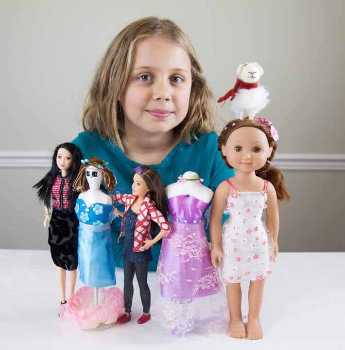 Daphne showing off her new fashion design skills on her dolls and the mannequins from the craft kits