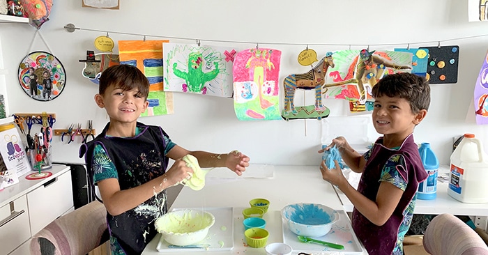 Two boys making slime in the RedViolet Studio