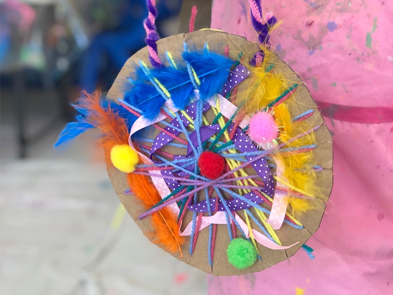 Cardboard circular weavings for kids with craft materials