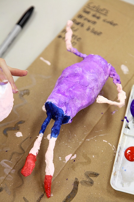 Painting and assembling a plaster cloth sculpture.