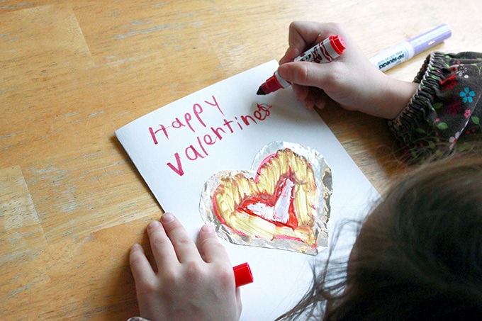 Child making a Happy Valentine's Day card