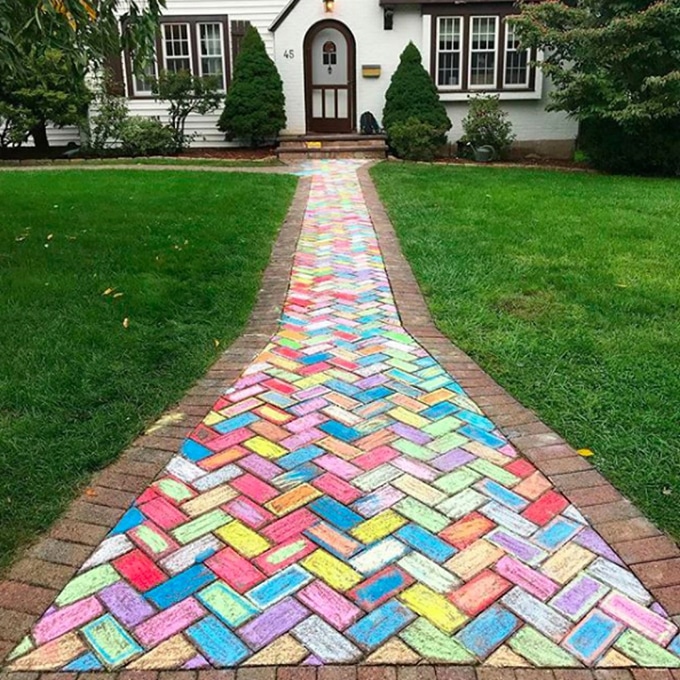 Rainbow colored brick sidewalk with Homegrown Friends