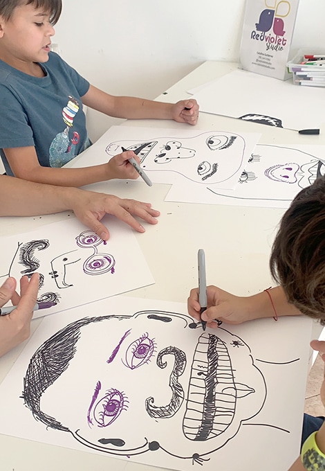 Family drawing collaborative portraits together