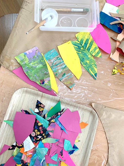 Cut out paper wings with glue and paintbrush