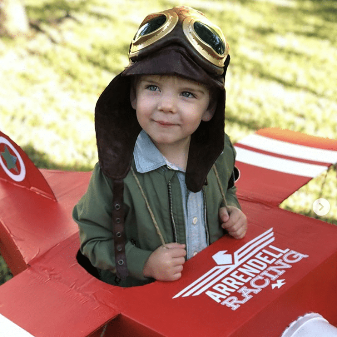 Child dressed as pilot with plane_jarrendell