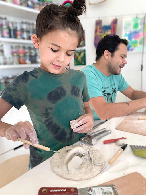 Child working with clay