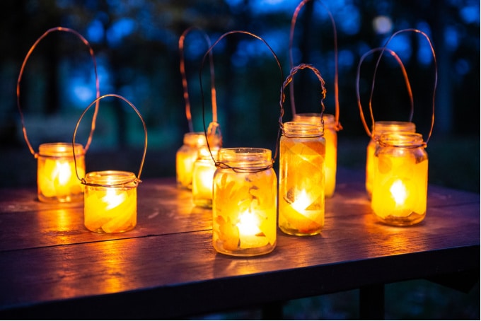 Decorative DIY glass lanterns standing on table