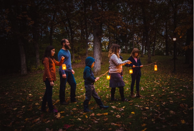 Family walking with DIY lanterns