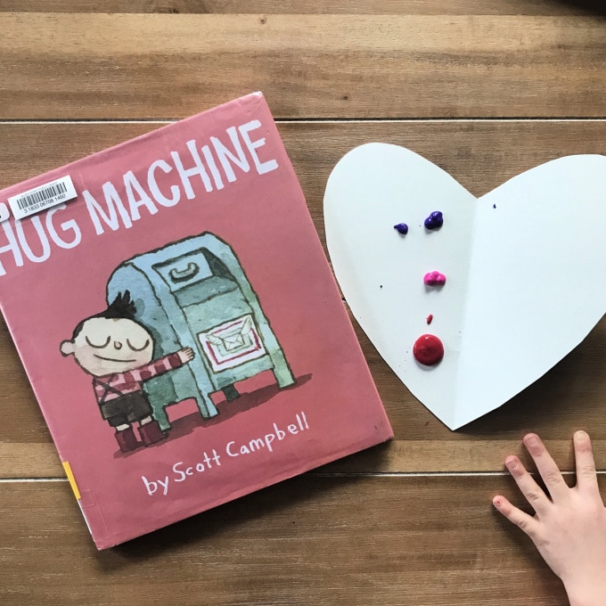 Hug machine book and heart symmetry painting
