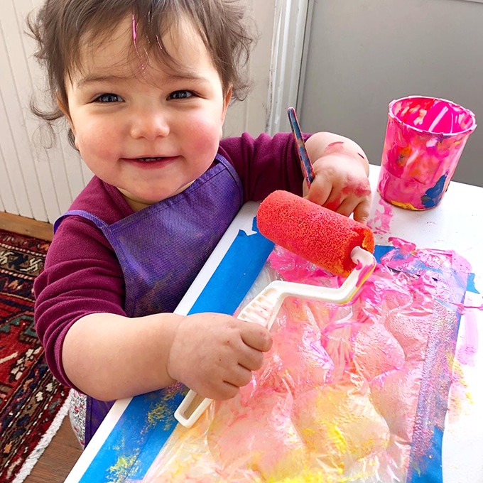 Child-rolling-paint-onto-bubble-wrap–Photo Rachel Withers