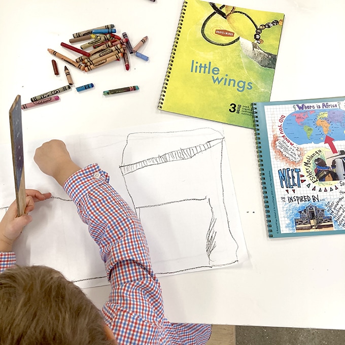 Child drawing using Little Wings & Roots kit