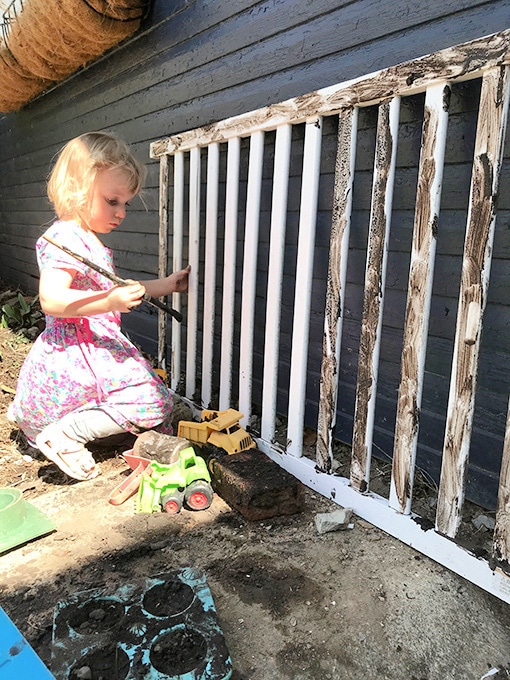 Child painting with mud paint_anna harpe
