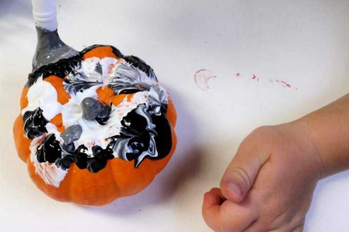 painting a pumpkin - halloween activities for kids