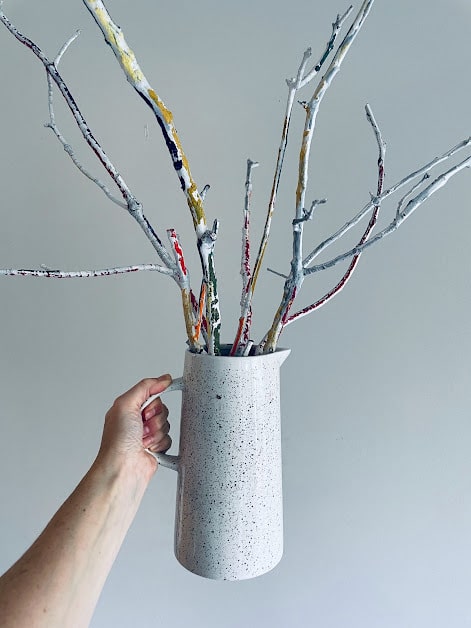 Painted sticks in a vase