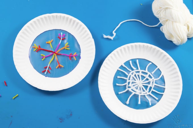 two paper plates with snowflakes