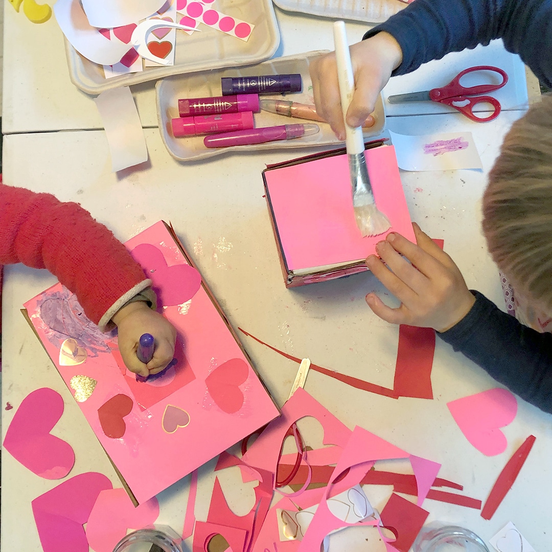 Kids creating valentine's day mailboxes