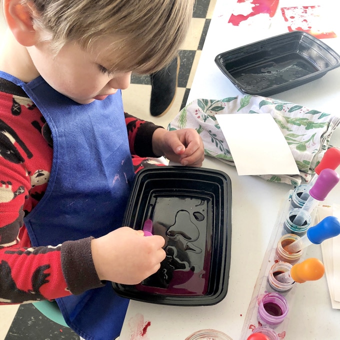 child marbling with oil