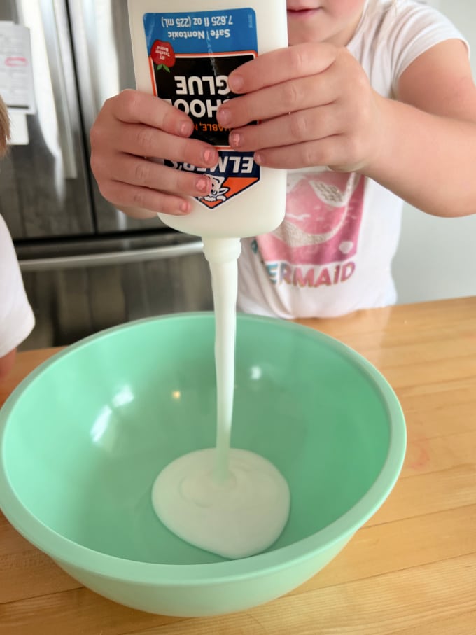 squeezing glue into bowl