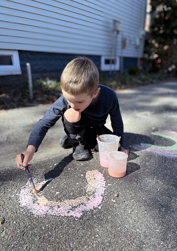 boy painting with chalk paint
