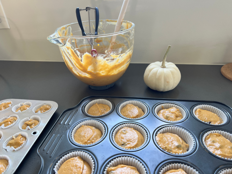 pumpkin muffin batter in tins