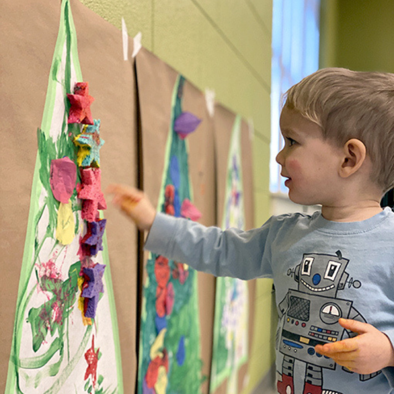 child stamping tree