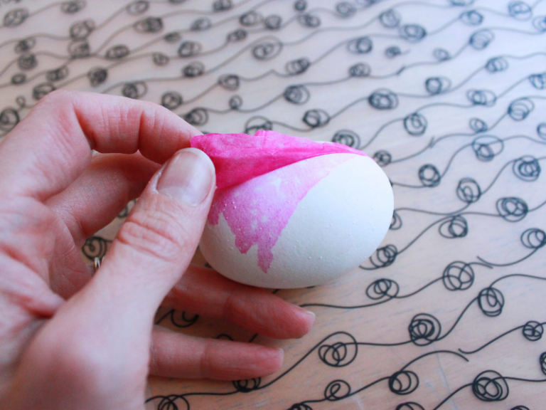 peeling paper off eggs