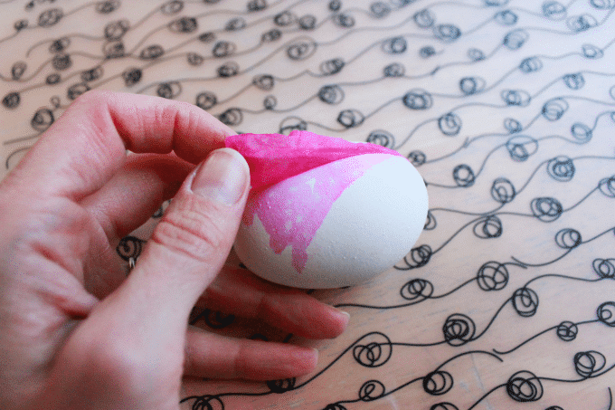 peeling tissue paper off eggs