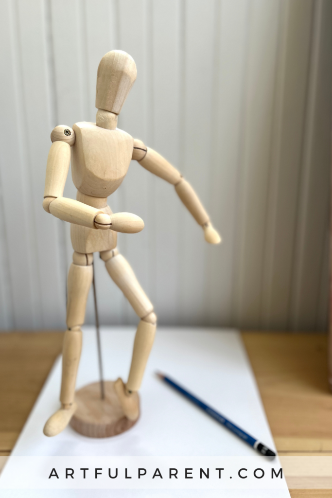 wooden mannequin drawing_ pin
