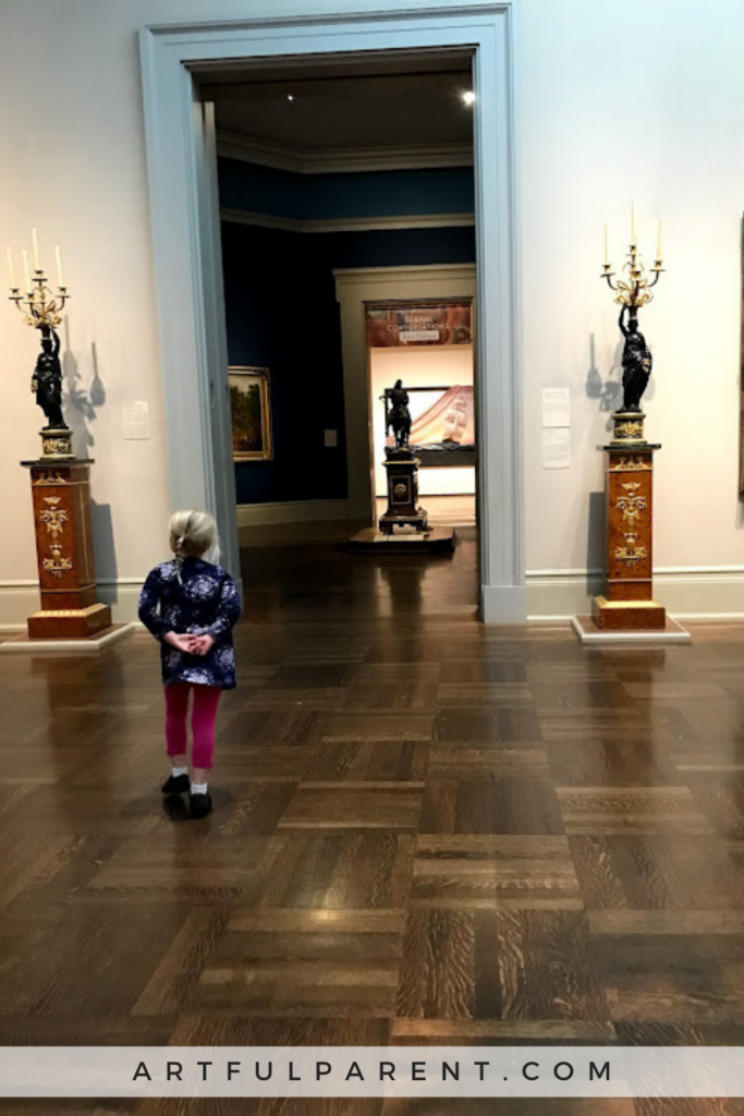 Girl looking at art in museum