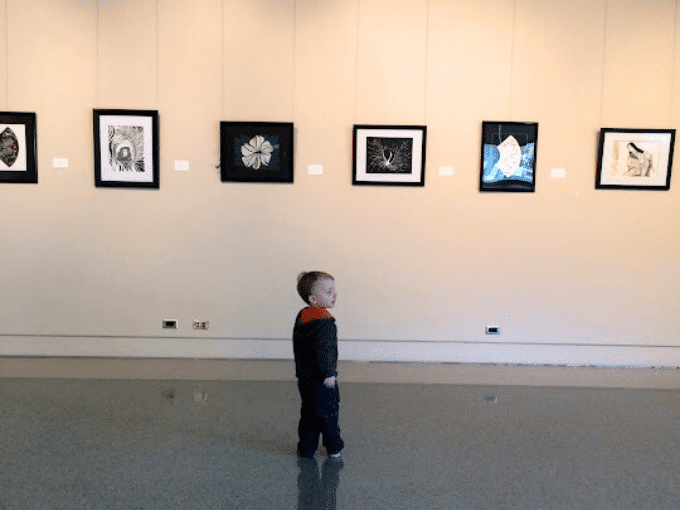 child visiting art museum