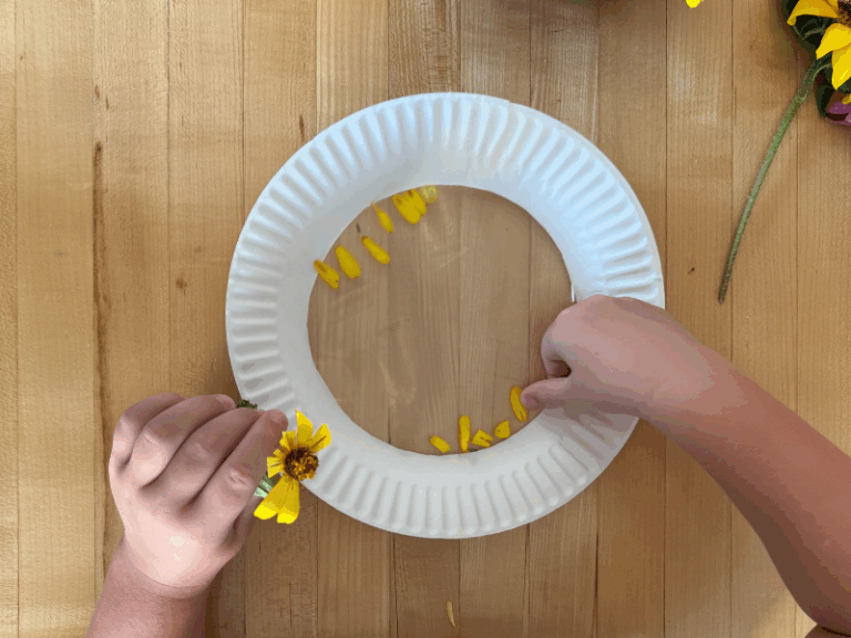 adding flowers to suncatcher