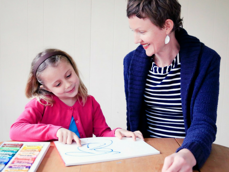 children and mother talking about art together