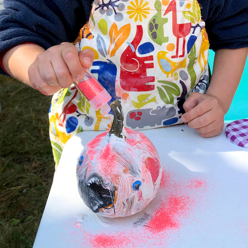 decorating pumpkin