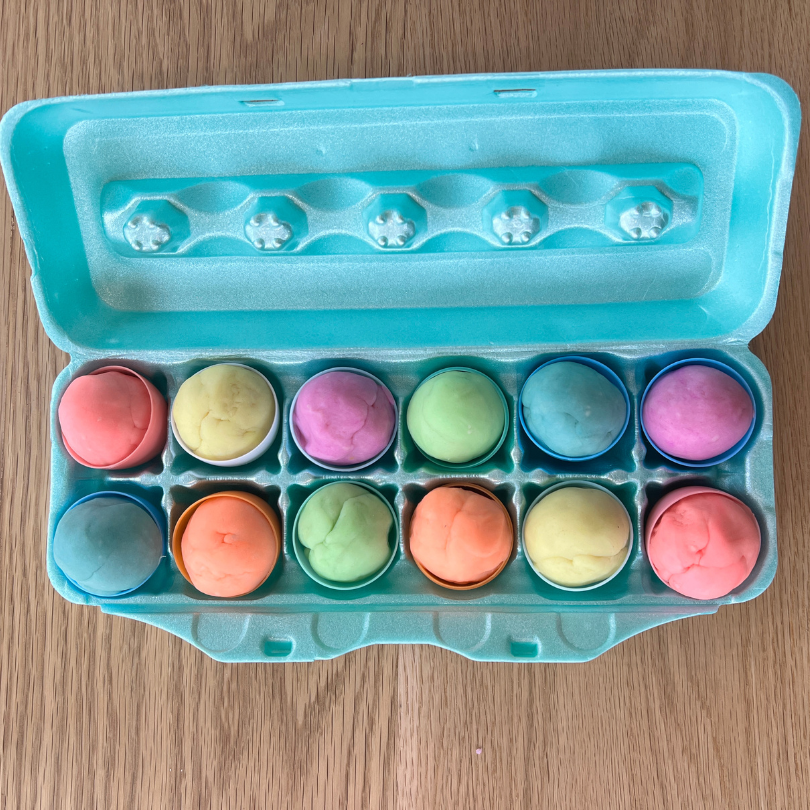 playdough in easter eggs