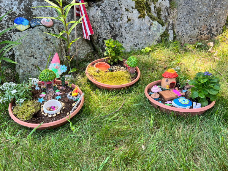 fairy houses by stone wall