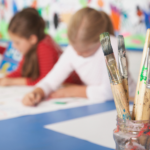 Kids working creatively in classroom
