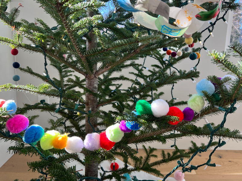 pom pom garland in tree