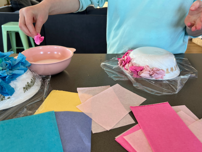 dipping tissue paper into glue