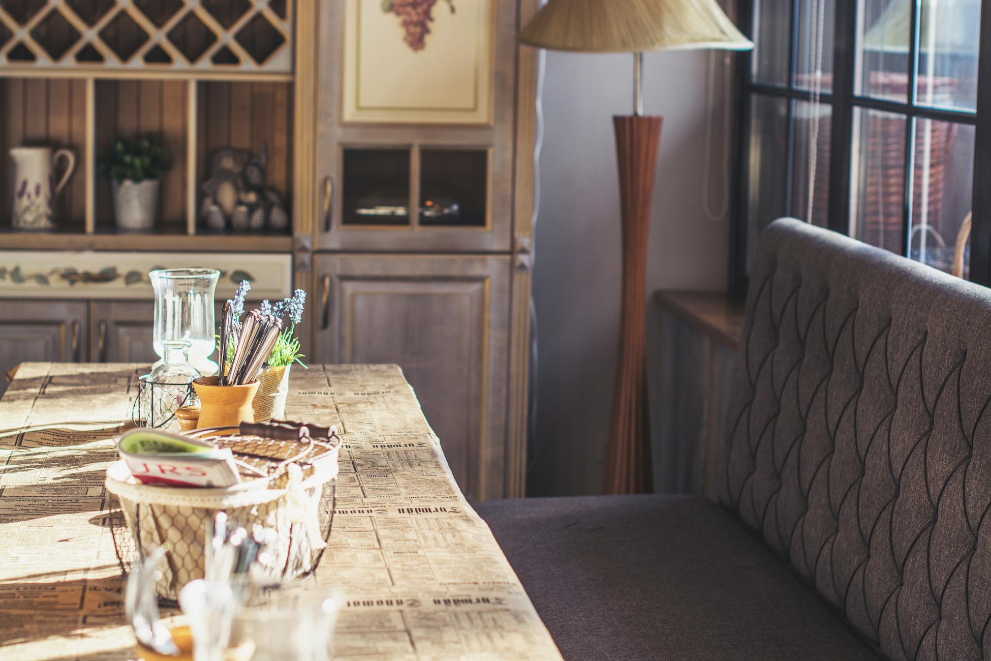 Warm and inviting café interior showcasing rustic wooden furniture and soft natural light.