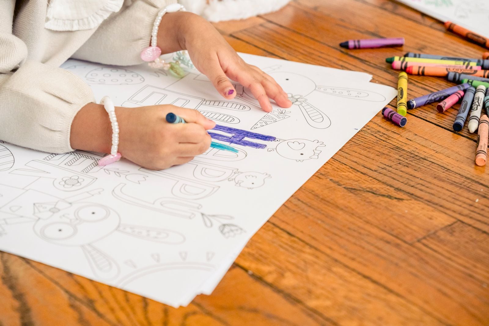 child drawing person crayon